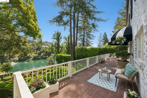 a view of a chair and table in the garden