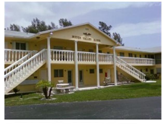 125 West Hidden Valley Boulevard, Unit 10 Boca Raton, FL 33487 - Photo 1 of 7 Front