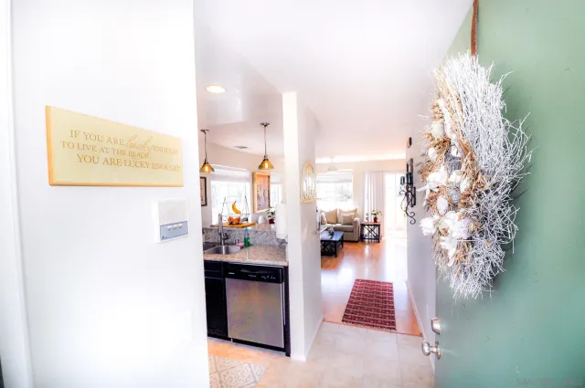 a en suite bathroom with a sink and shower curtain