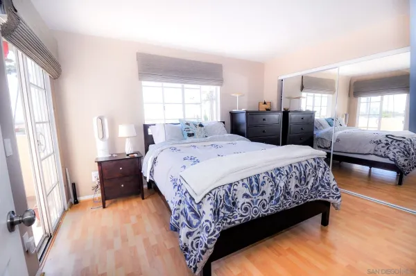 a bedroom with bed and window