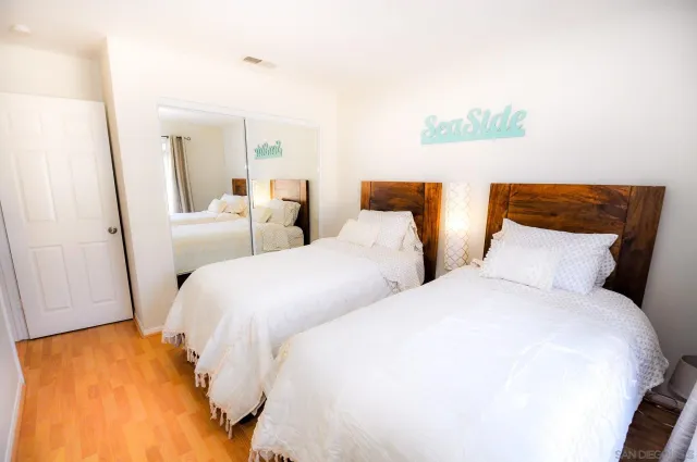 a large white bed in a white room