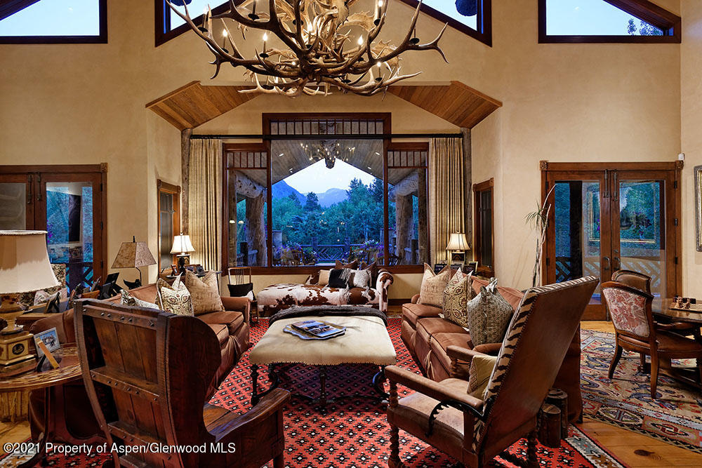 31 Northstar Circle Aspen, CO 81611 - Photo 13 of 51 a living room with furniture a chandelier and a dining table