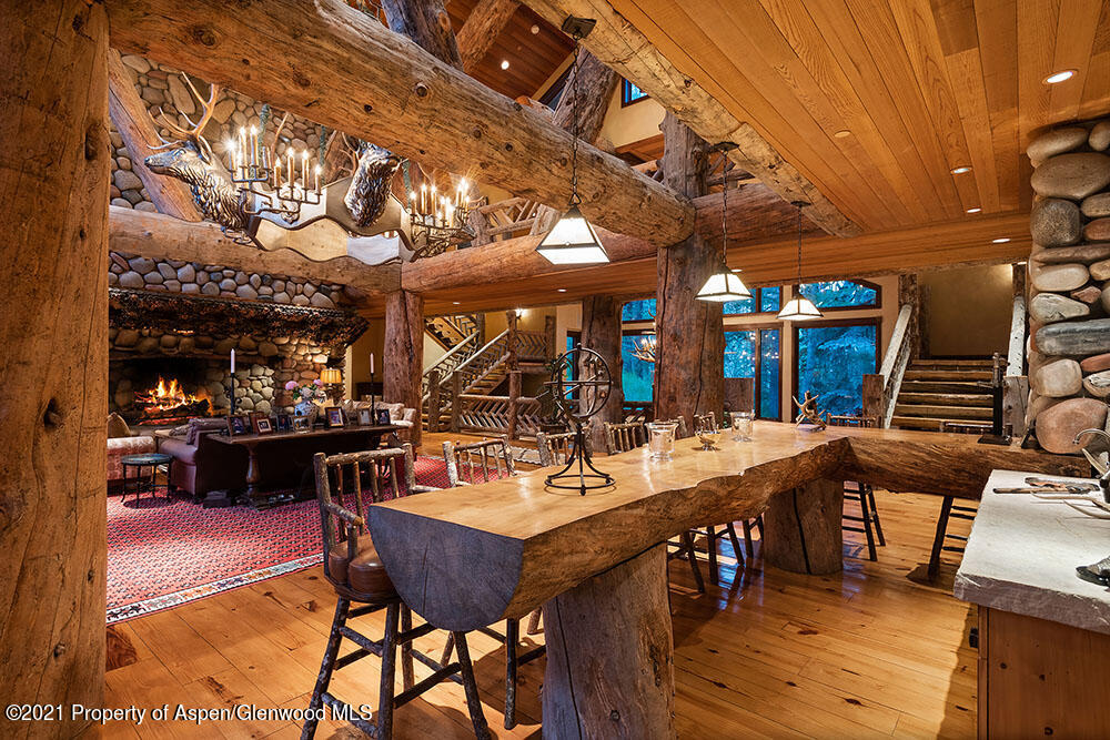 31 Northstar Circle Aspen, CO 81611 - Photo 14 of 51 a view of a dining table and chairs in a patio