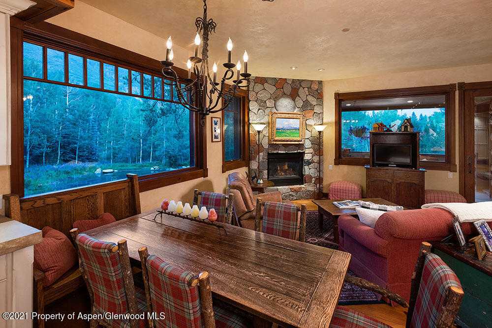 31 Northstar Circle Aspen, CO 81611 - Photo 18 of 51 a view of a dining room with furniture a chandelier and window