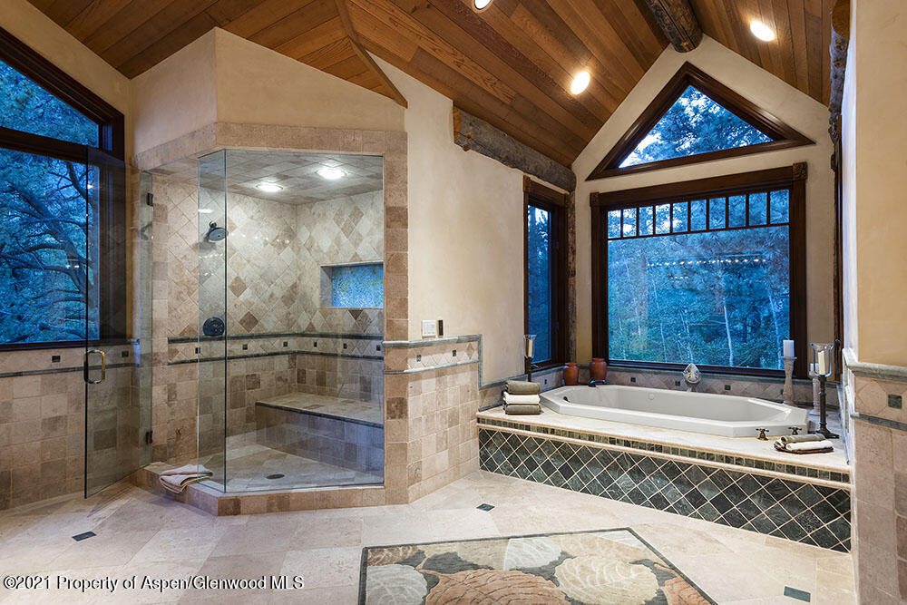 31 Northstar Circle Aspen, CO 81611 - Photo 28 of 51 a bathroom with a granite countertop sink and a large mirror