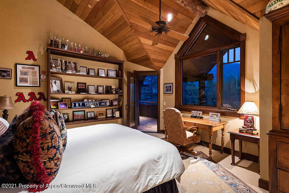 31 Northstar Circle Aspen, CO 81611 - Photo 29 of 51 a bed room with a bed and a book shelf