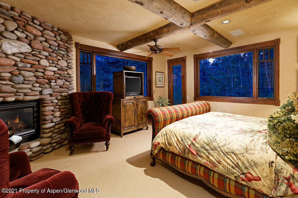 31 Northstar Circle Aspen, CO 81611 - Photo 30 of 51 a bed room with a bed and a chair