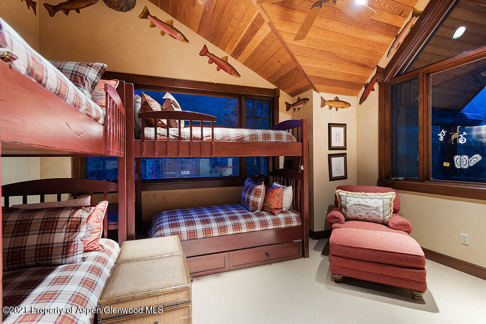 31 Northstar Circle Aspen, CO 81611 - Photo 32 of 51 a bedroom with furniture and a fireplace