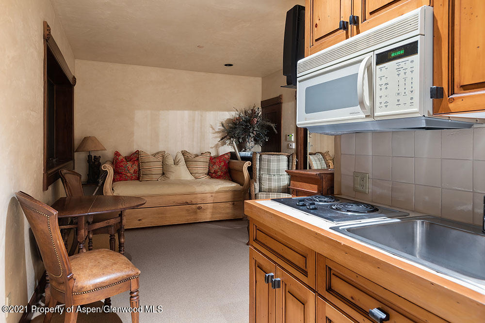 31 Northstar Circle Aspen, CO 81611 - Photo 40 of 51 a living room with furniture and a fireplace