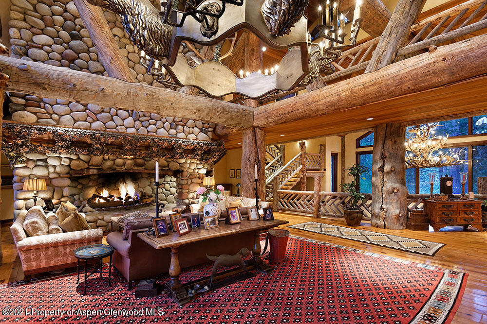 31 Northstar Circle Aspen, CO 81611 - Photo 9 of 51 a living room with furniture and a chandelier