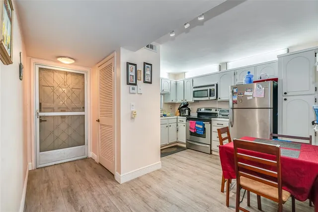 a kitchen view with a refrigerator and a refrigerator