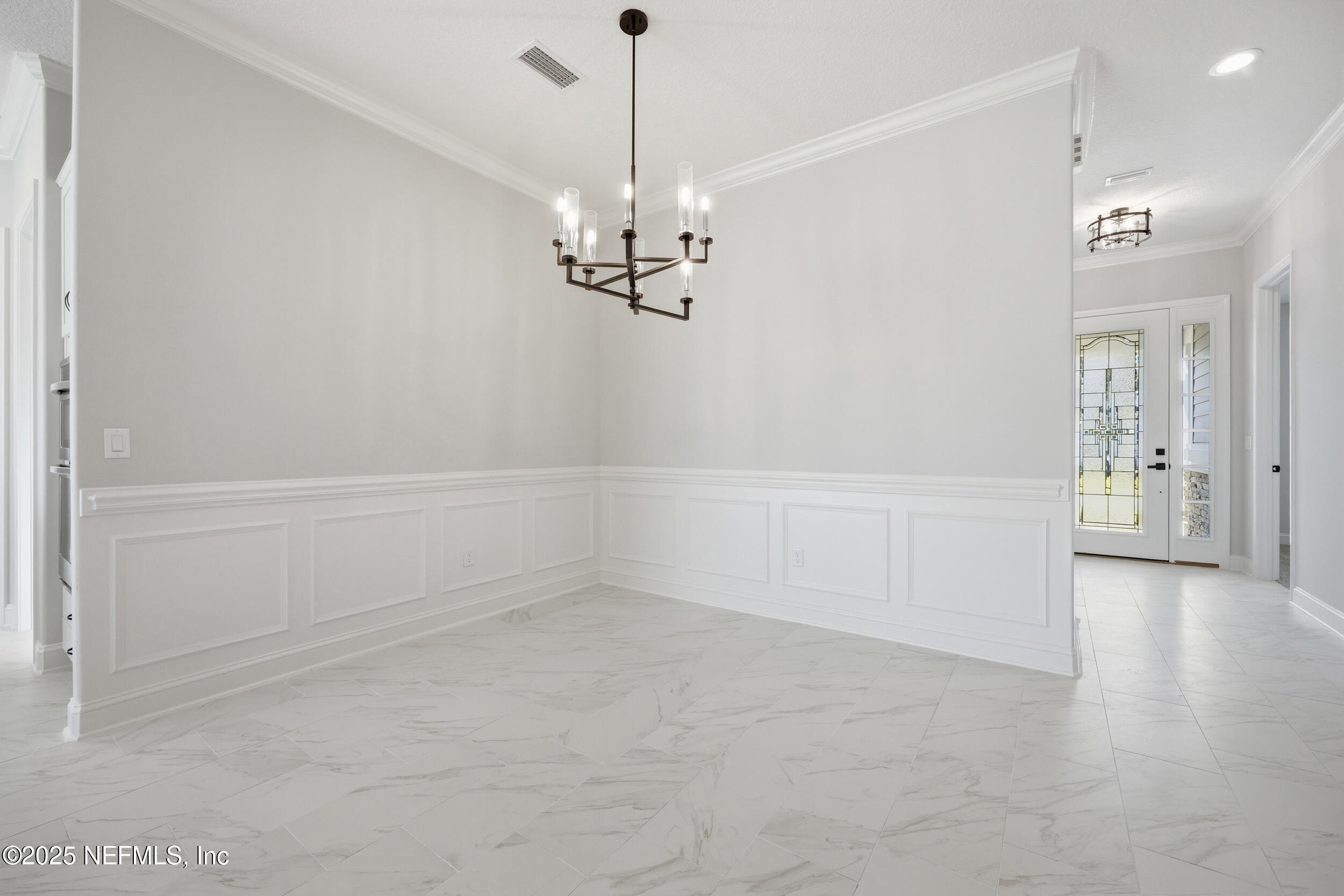 107 Firecrest Drive St. Augustine, FL 32092 - Photo 14 of 27 a view of a chandelier in an empty room