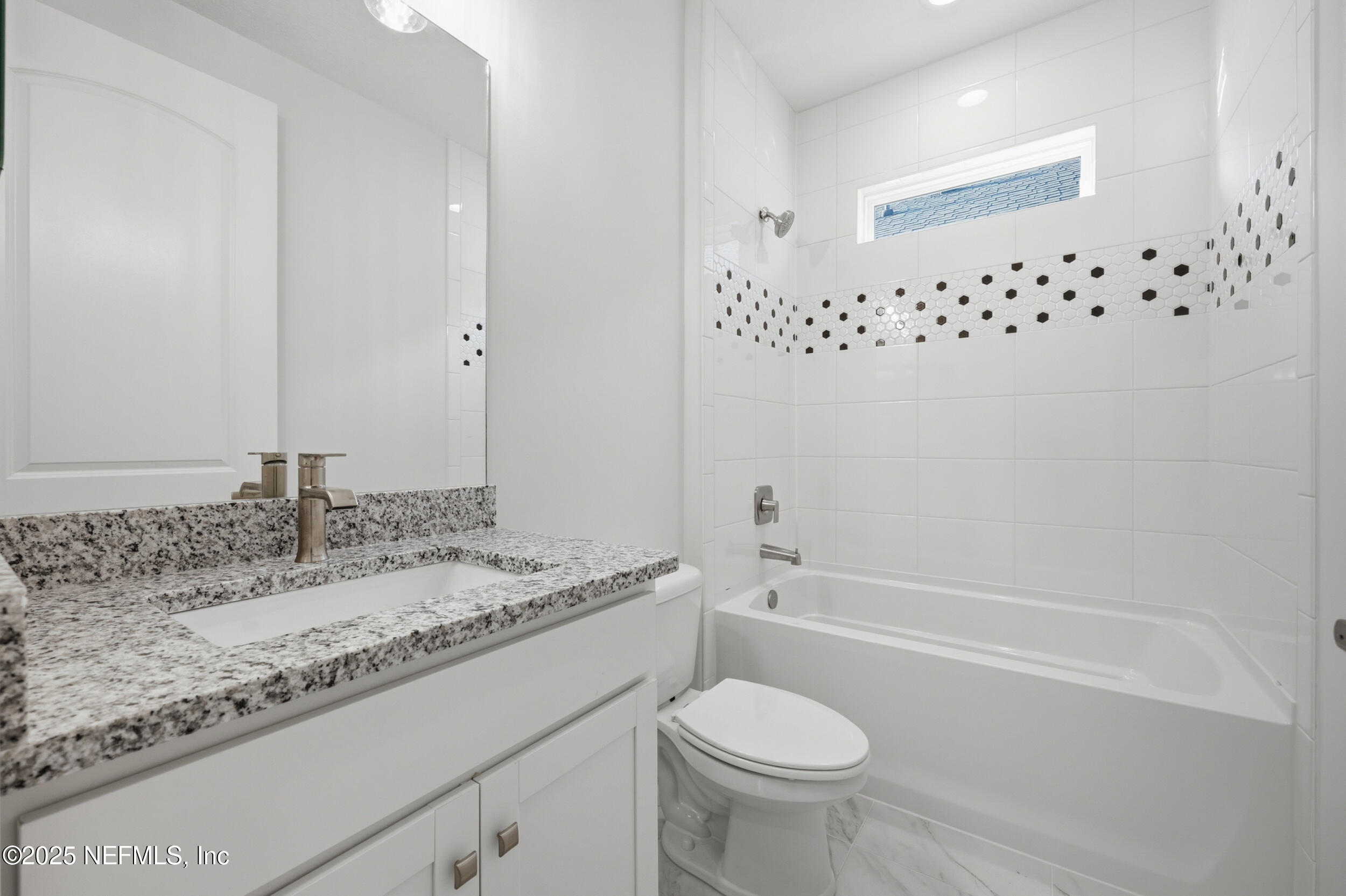 107 Firecrest Drive St. Augustine, FL 32092 - Photo 16 of 27 a bathroom with a granite countertop sink and a mirror