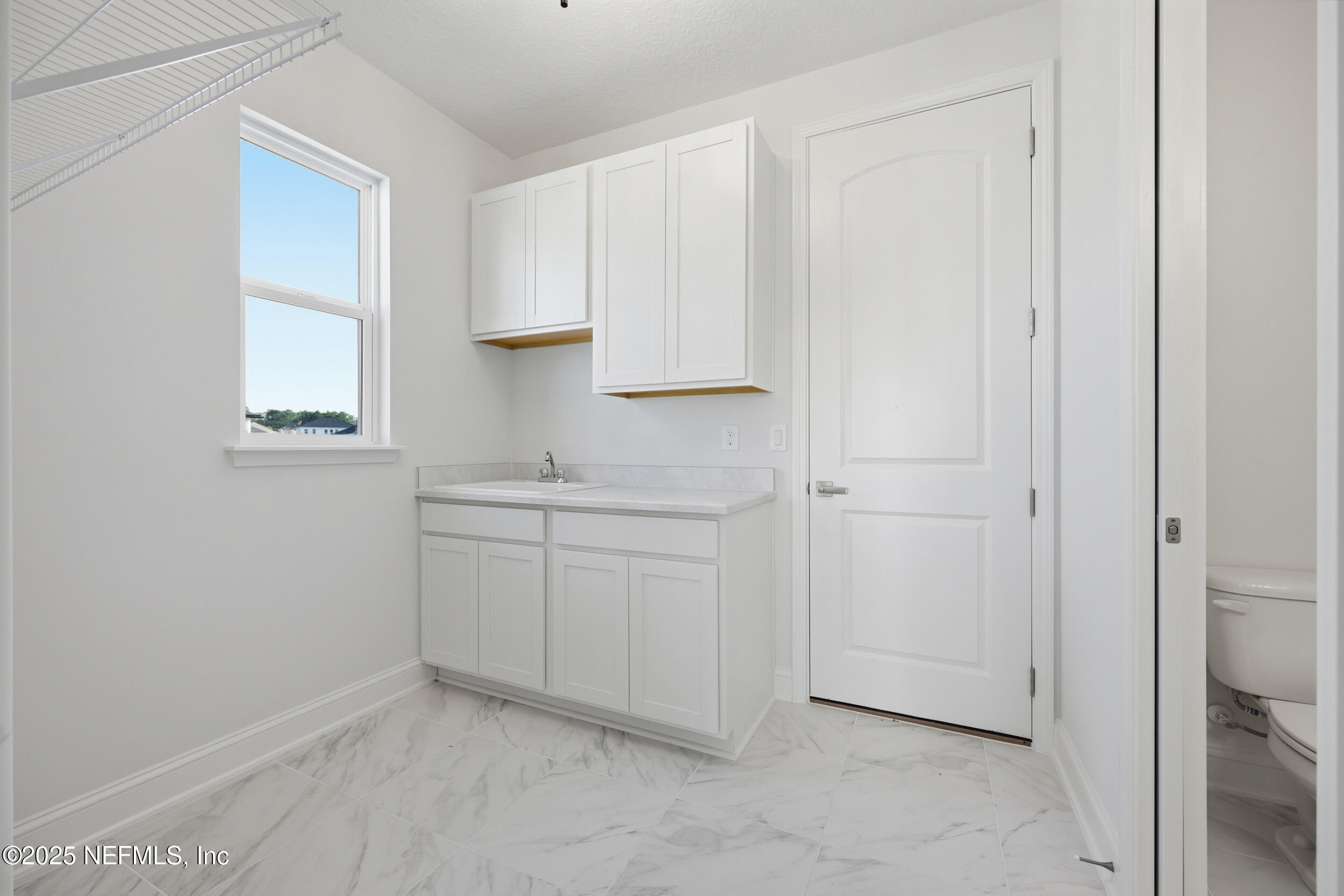 107 Firecrest Drive St. Augustine, FL 32092 - Photo 18 of 27 a room view with a window and a sink