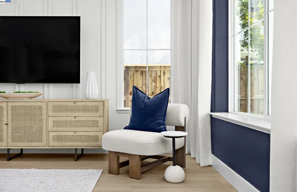 a view of living room with furniture and a flat screen tv