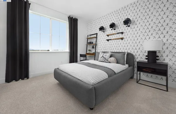 a bedroom with a bed and a lamp on the dresser