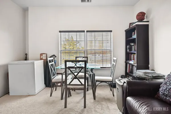 a work room with furniture and a window