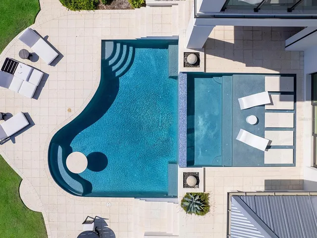 a bedroom with a bed and a table