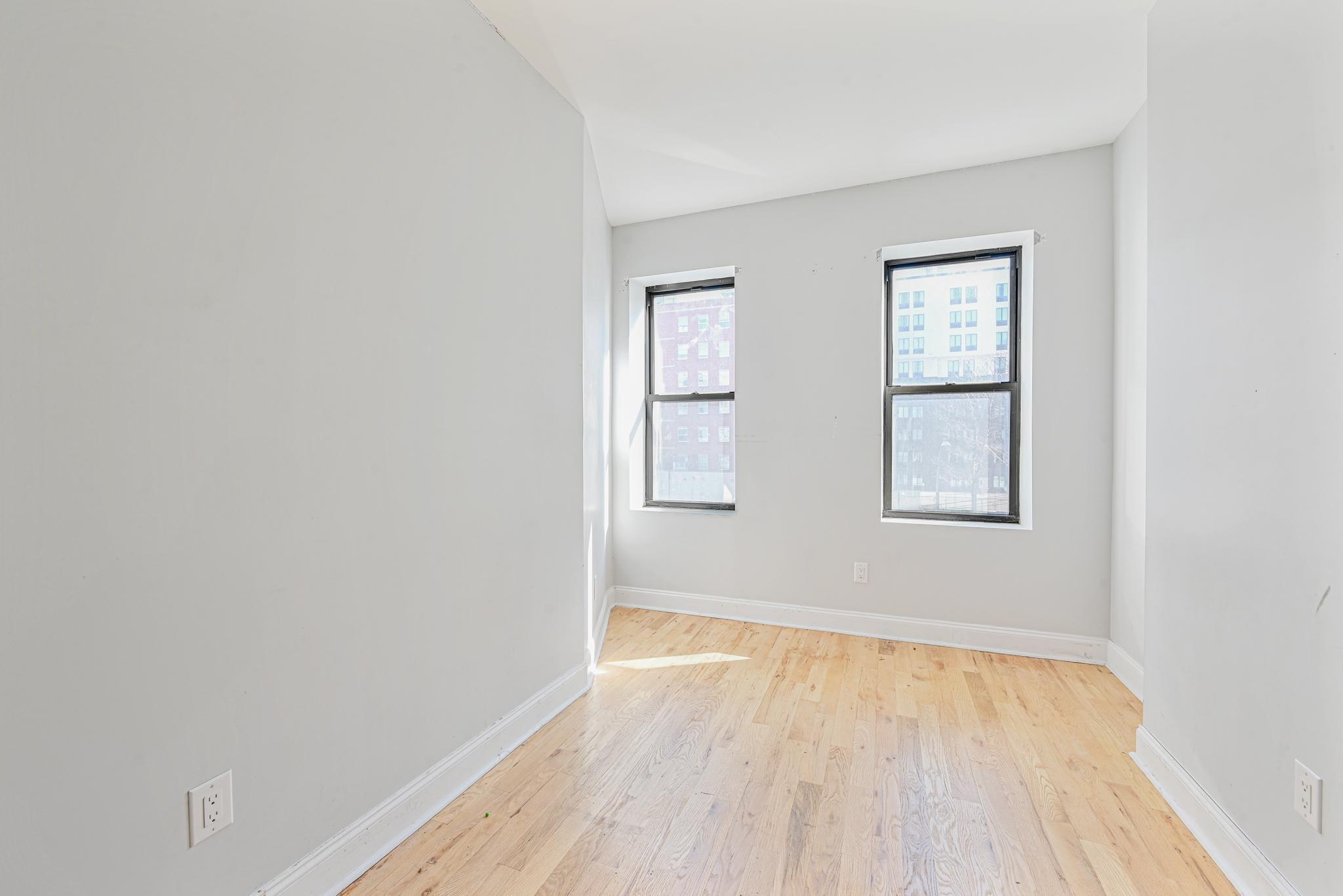 2243 Bathgate Avenue Bronx, NY 10457 - Photo 15 of 26 Spare room featuring light wood-type flooring