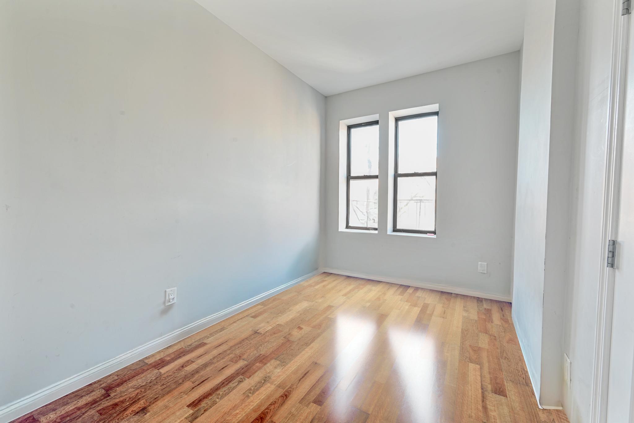 2243 Bathgate Avenue Bronx, NY 10457 - Photo 17 of 26 Spare room featuring light wood-type flooring