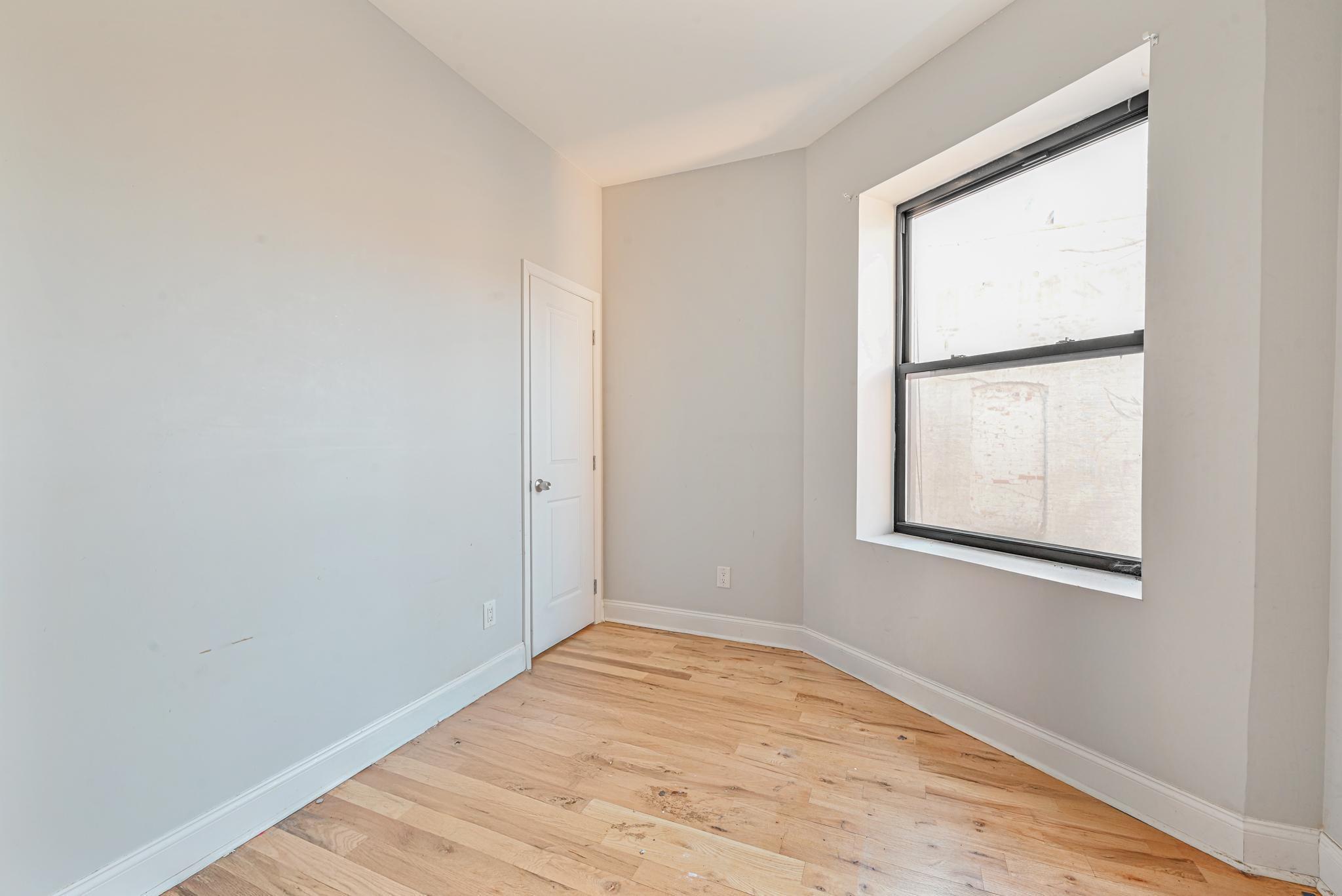 2243 Bathgate Avenue Bronx, NY 10457 - Photo 18 of 26 Empty room featuring light wood-type flooring