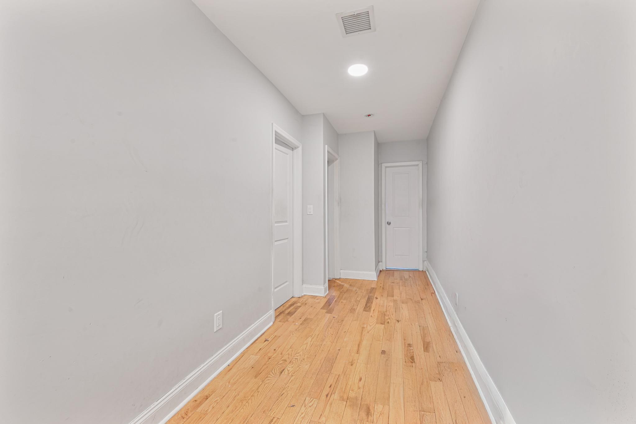 2243 Bathgate Avenue Bronx, NY 10457 - Photo 8 of 26 Hallway with light hardwood / wood-style flooring