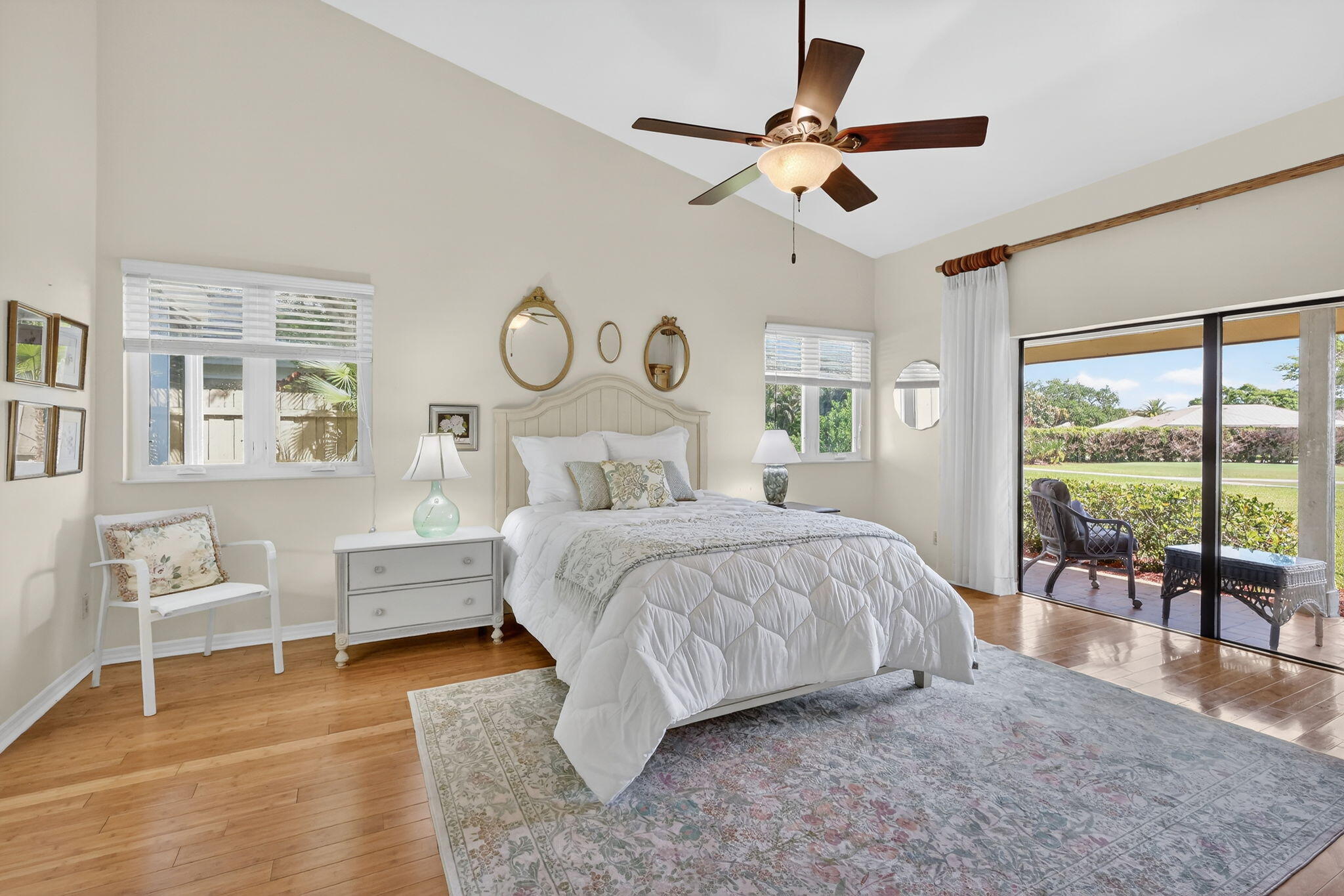 6151 Southeast Winged Foot Drive Stuart, FL 34997 - Photo 11 of 47 a bedroom with a large bed and a large window