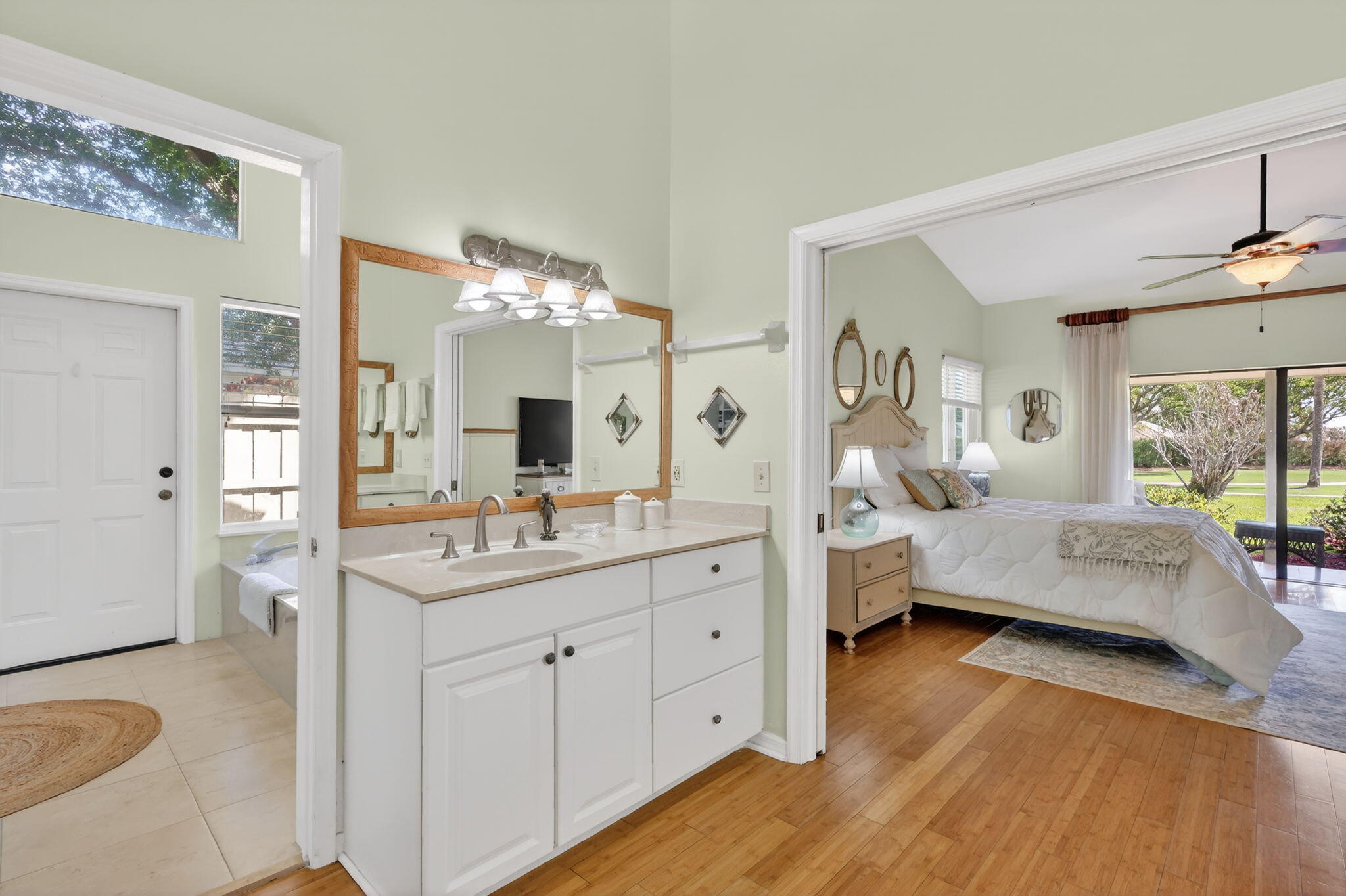 6151 Southeast Winged Foot Drive Stuart, FL 34997 - Photo 15 of 47 a spacious bathroom with a double vanity sink a mirror and a shower