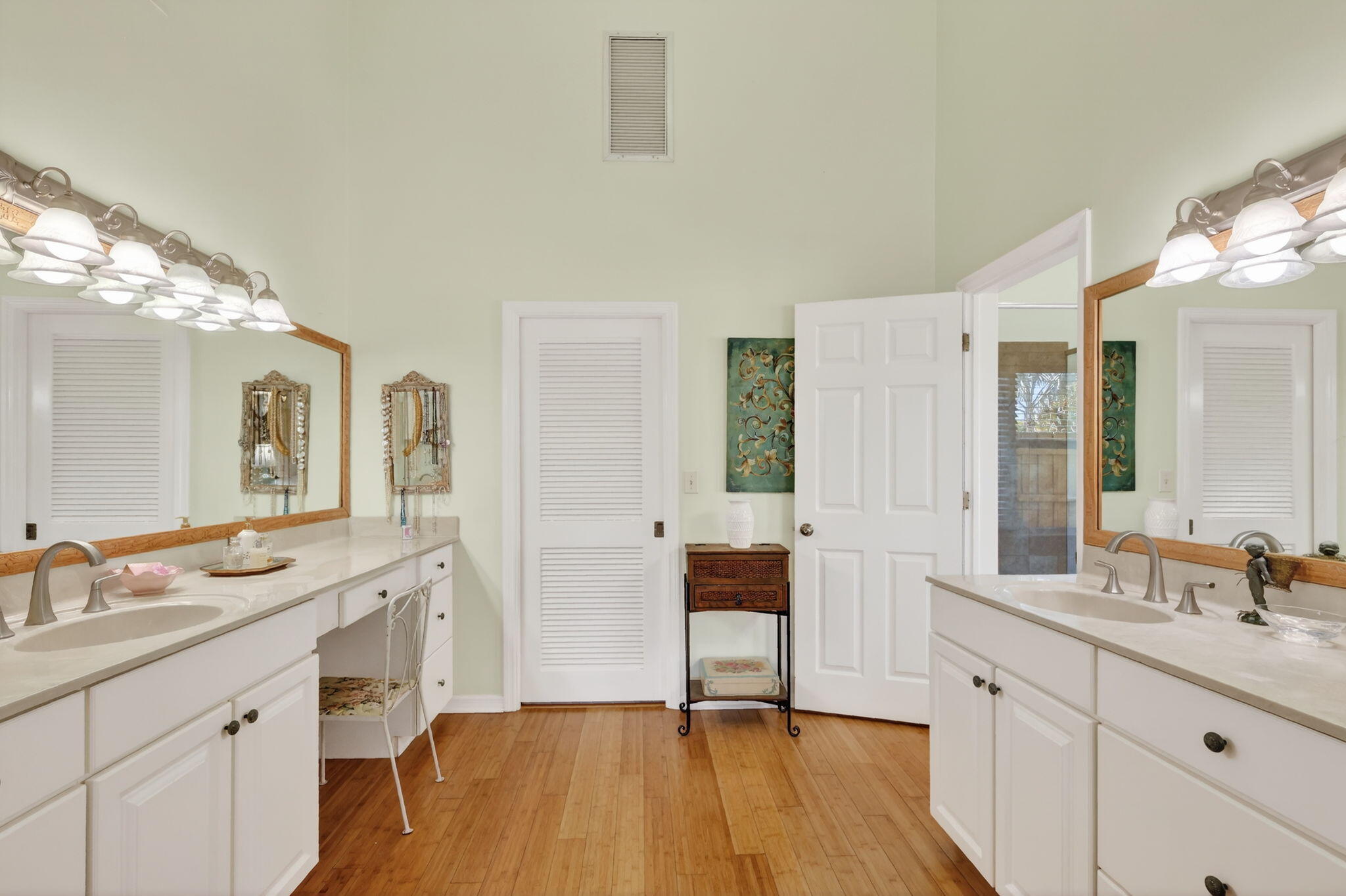 6151 Southeast Winged Foot Drive Stuart, FL 34997 - Photo 18 of 47 a spacious bathroom with a double vanity sink a mirror and a shower