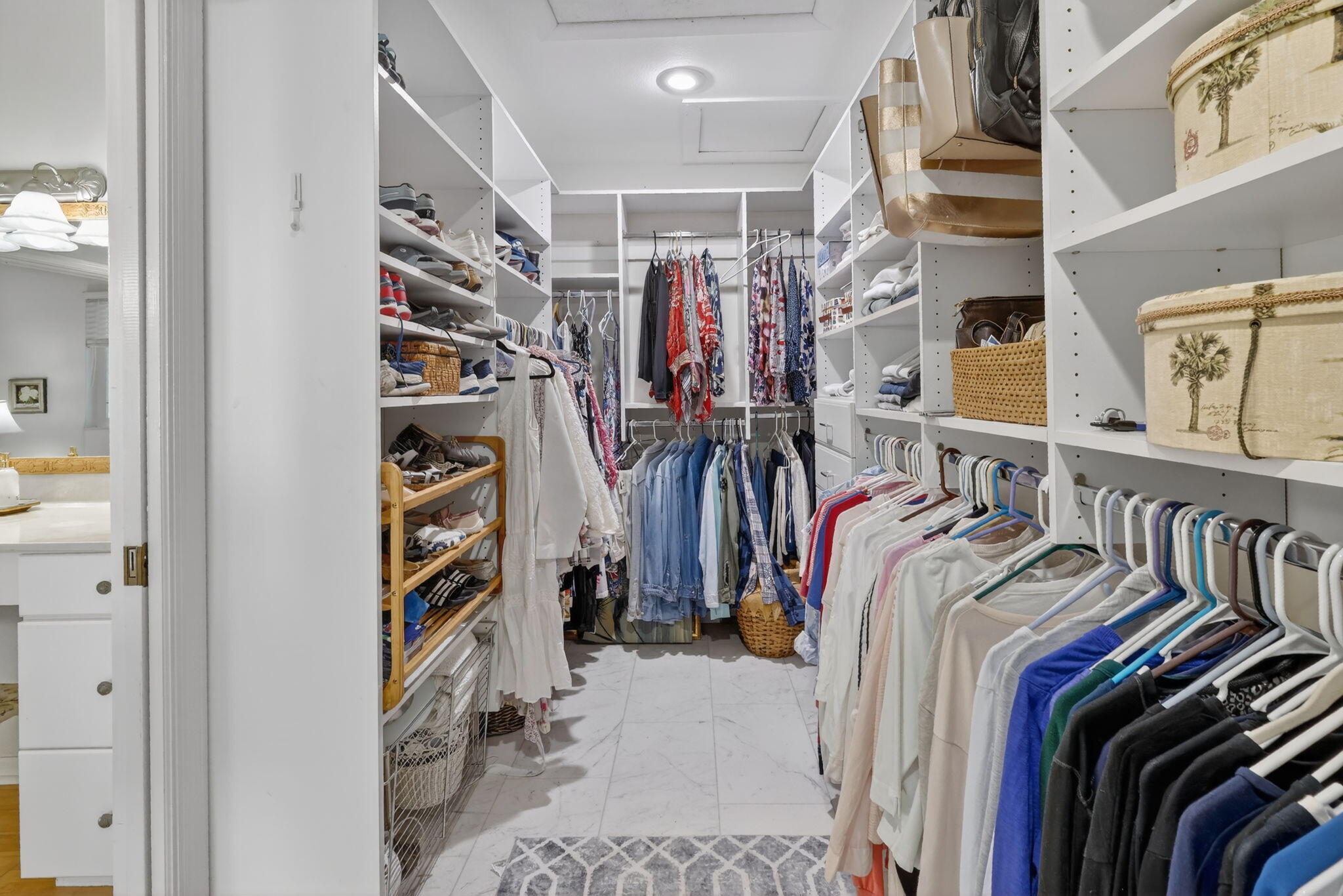 6151 Southeast Winged Foot Drive Stuart, FL 34997 - Photo 20 of 47 a view of walk in closet with clothes and shoes