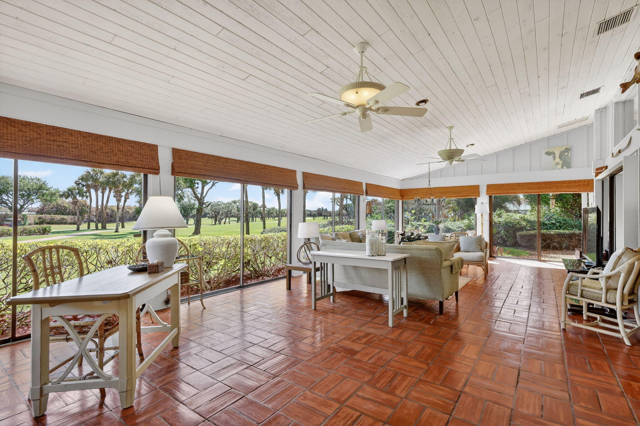 6151 Southeast Winged Foot Drive Stuart, FL 34997 - Photo 25 of 47 a living room with patio furniture and a floor to ceiling window