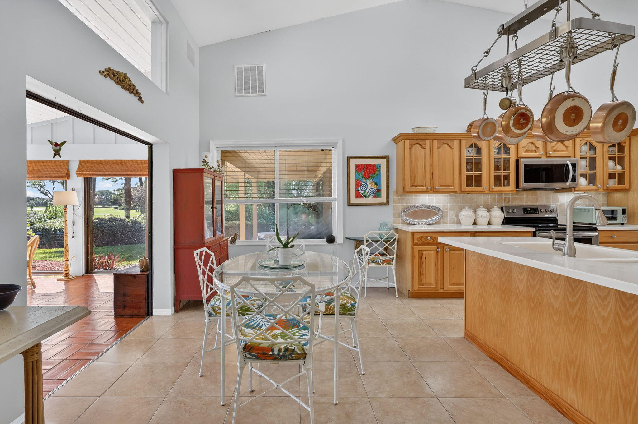 6151 Southeast Winged Foot Drive Stuart, FL 34997 - Photo 29 of 47 a large kitchen with stainless steel appliances granite countertop a sink and cabinets