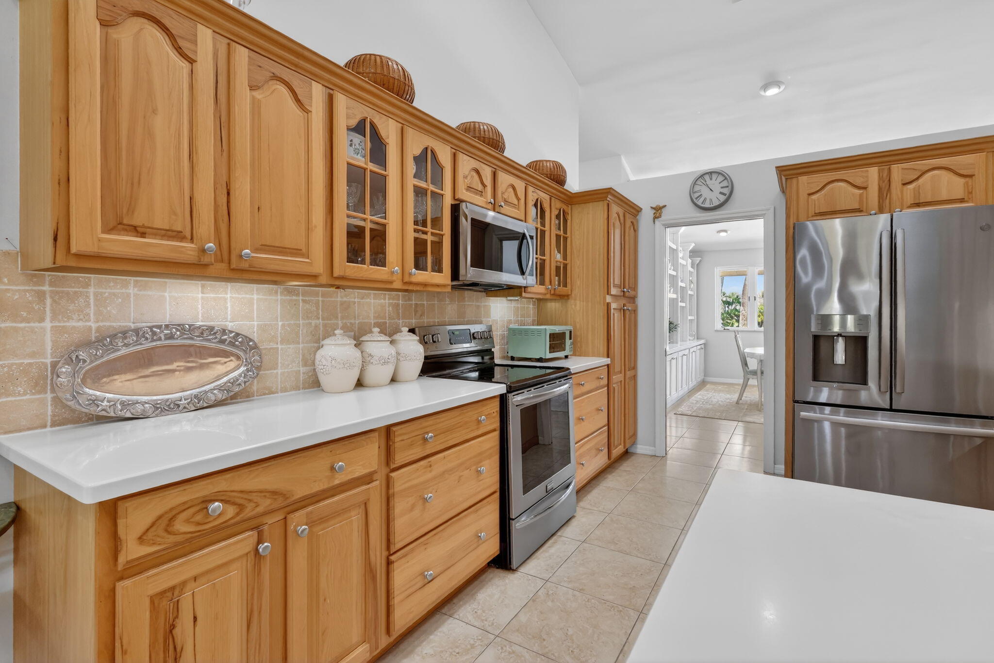 6151 Southeast Winged Foot Drive Stuart, FL 34997 - Photo 30 of 47 a kitchen with stainless steel appliances granite countertop a refrigerator and a sink
