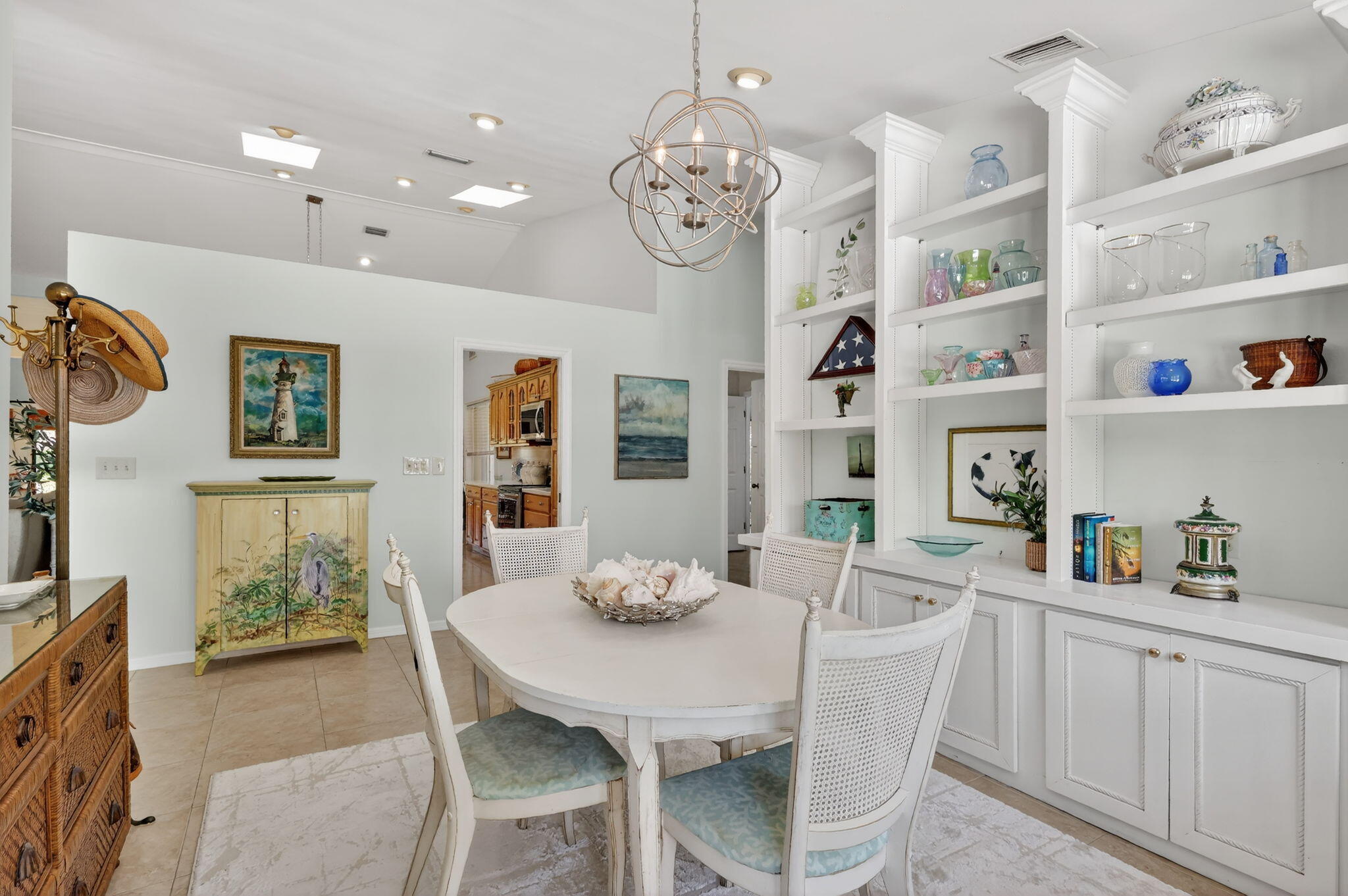 6151 Southeast Winged Foot Drive Stuart, FL 34997 - Photo 34 of 47 a view of dining room and kitchen with furniture and chandelier