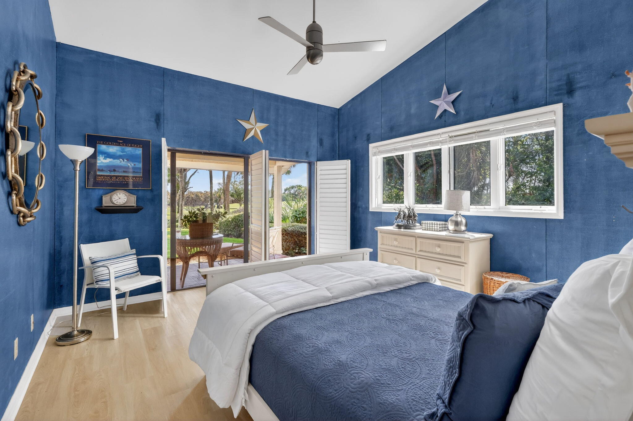 6151 Southeast Winged Foot Drive Stuart, FL 34997 - Photo 35 of 47 a bed room with a bed and a chair