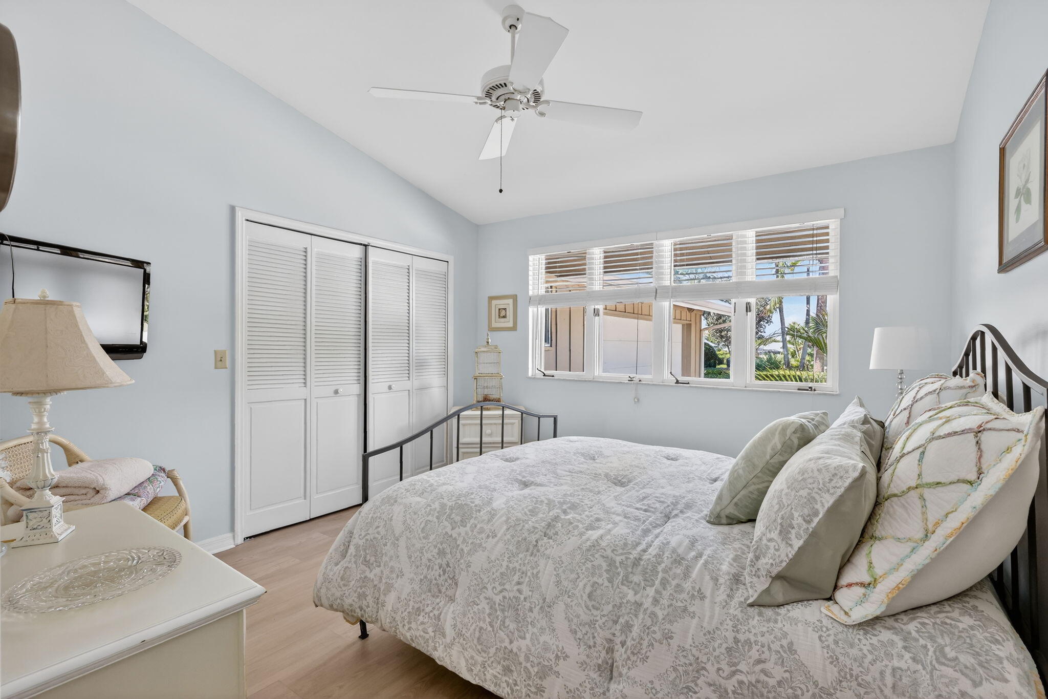 6151 Southeast Winged Foot Drive Stuart, FL 34997 - Photo 39 of 47 a bedroom with a bed and a large mirror