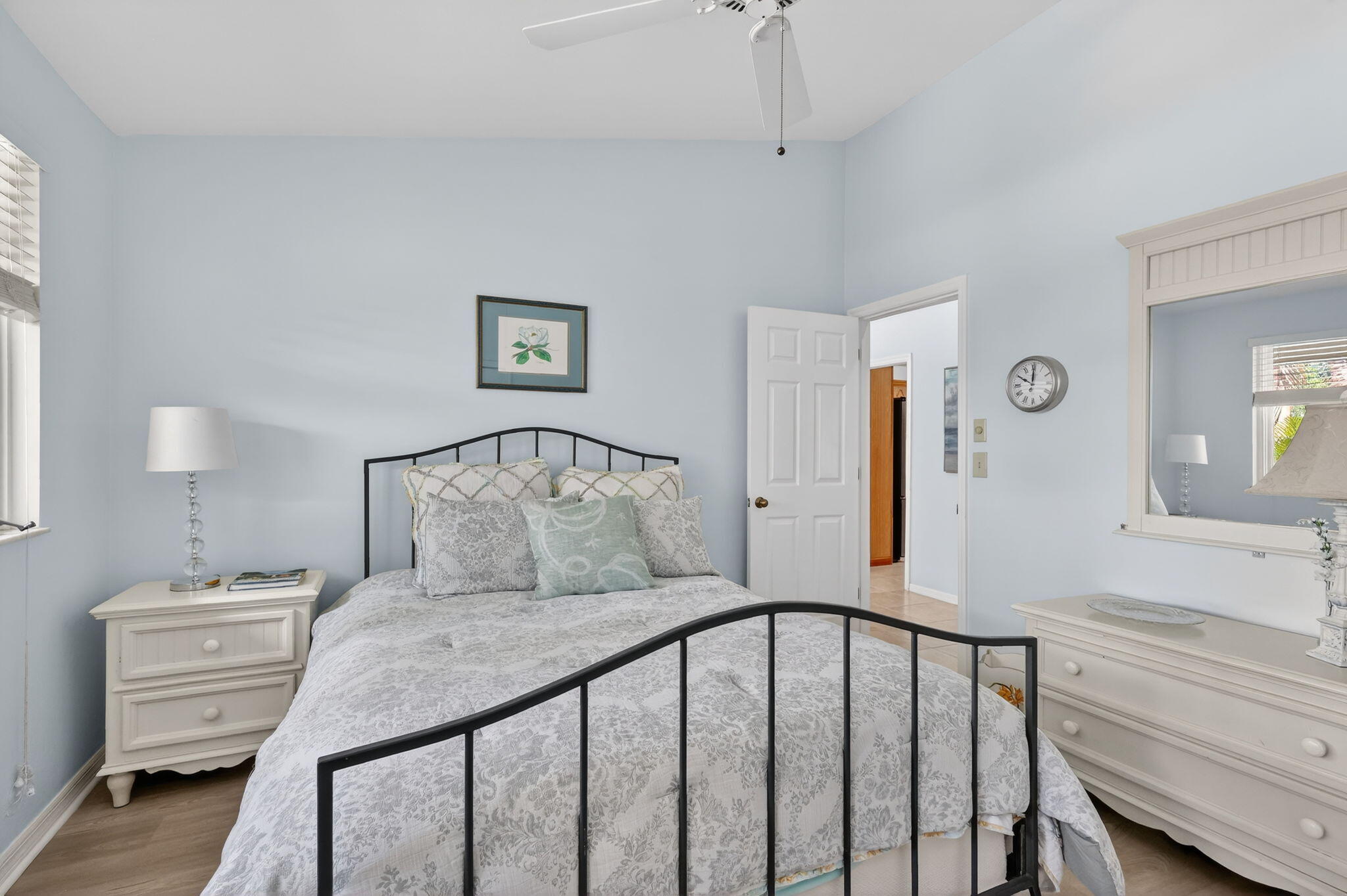 6151 Southeast Winged Foot Drive Stuart, FL 34997 - Photo 40 of 47 a bedroom with a bed and a dresser