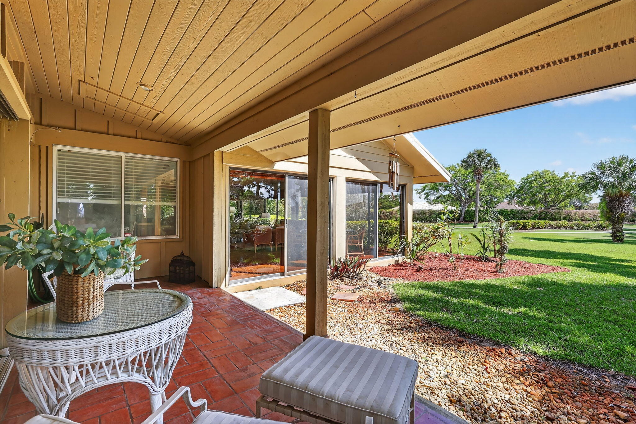 6151 Southeast Winged Foot Drive Stuart, FL 34997 - Photo 42 of 47 a view of a house with backyard and porch