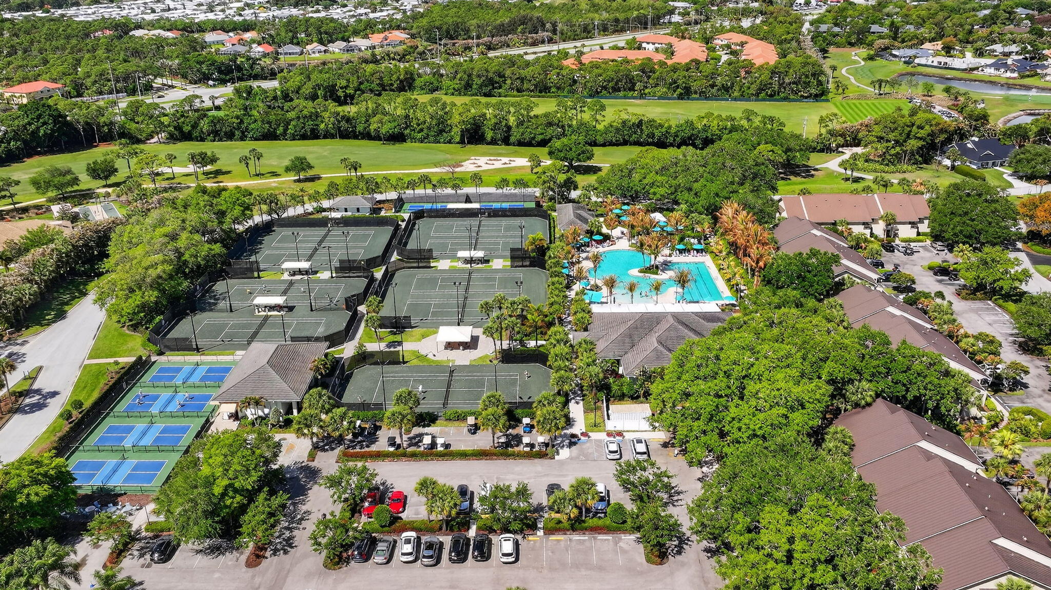 6151 Southeast Winged Foot Drive Stuart, FL 34997 - Photo 45 of 47 an aerial view of a houses and city street