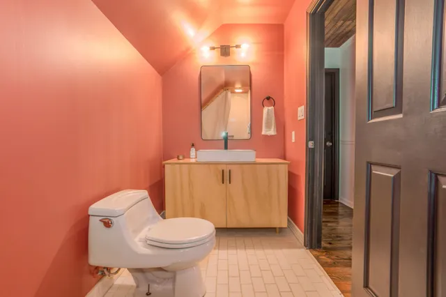 a storage room with wooden floor washer and dryer
