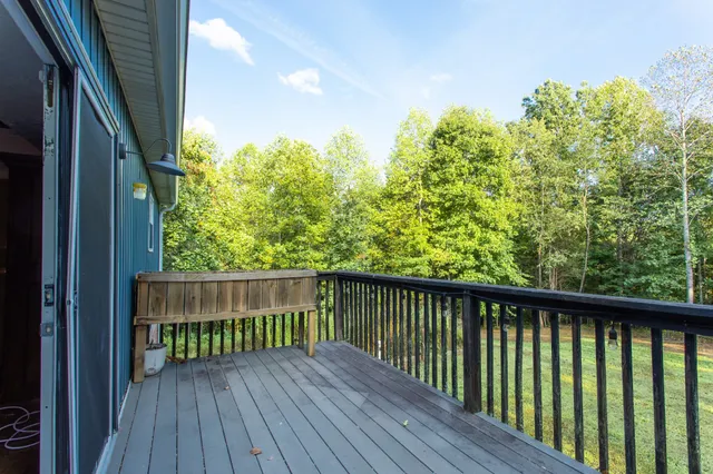 a view of balcony with wooden floor