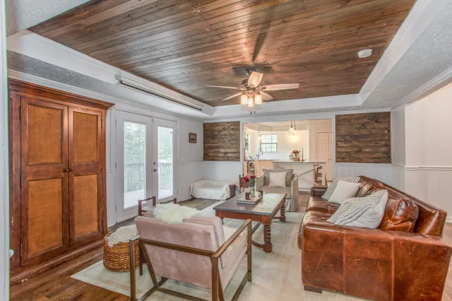a living room with furniture and a window
