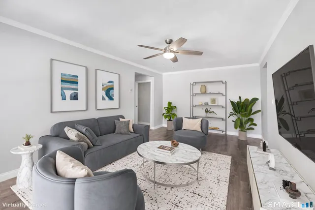 a living room with furniture and a table
