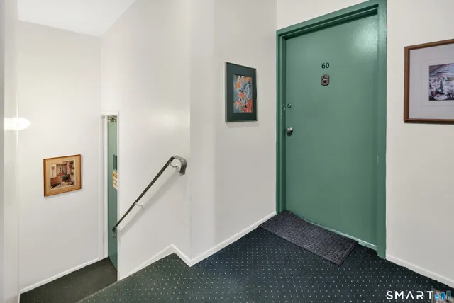 a view of an entryway with front door