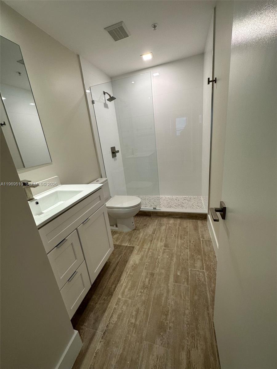 801 Brickell Key Boulevard, Unit 809 Miami, FL 33131 - Photo 12 of 17 a bathroom with a sink and toilet