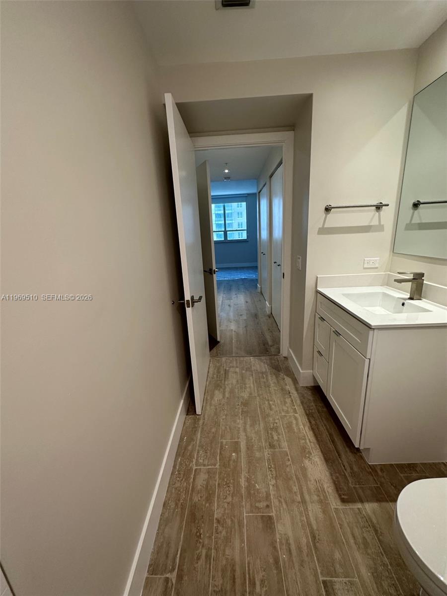 801 Brickell Key Boulevard, Unit 809 Miami, FL 33131 - Photo 13 of 17 a bathroom with a sink and mirror