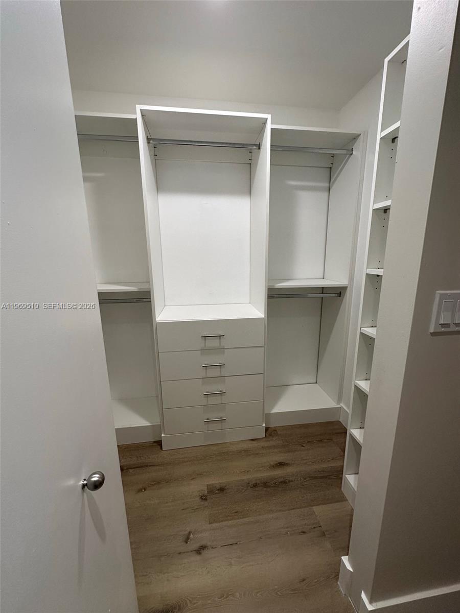 801 Brickell Key Boulevard, Unit 809 Miami, FL 33131 - Photo 8 of 17 a view of walk in closet