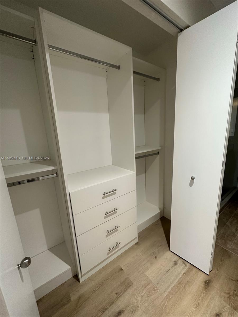 801 Brickell Key Boulevard, Unit 809 Miami, FL 33131 - Photo 9 of 17 a view of an empty walk in closet