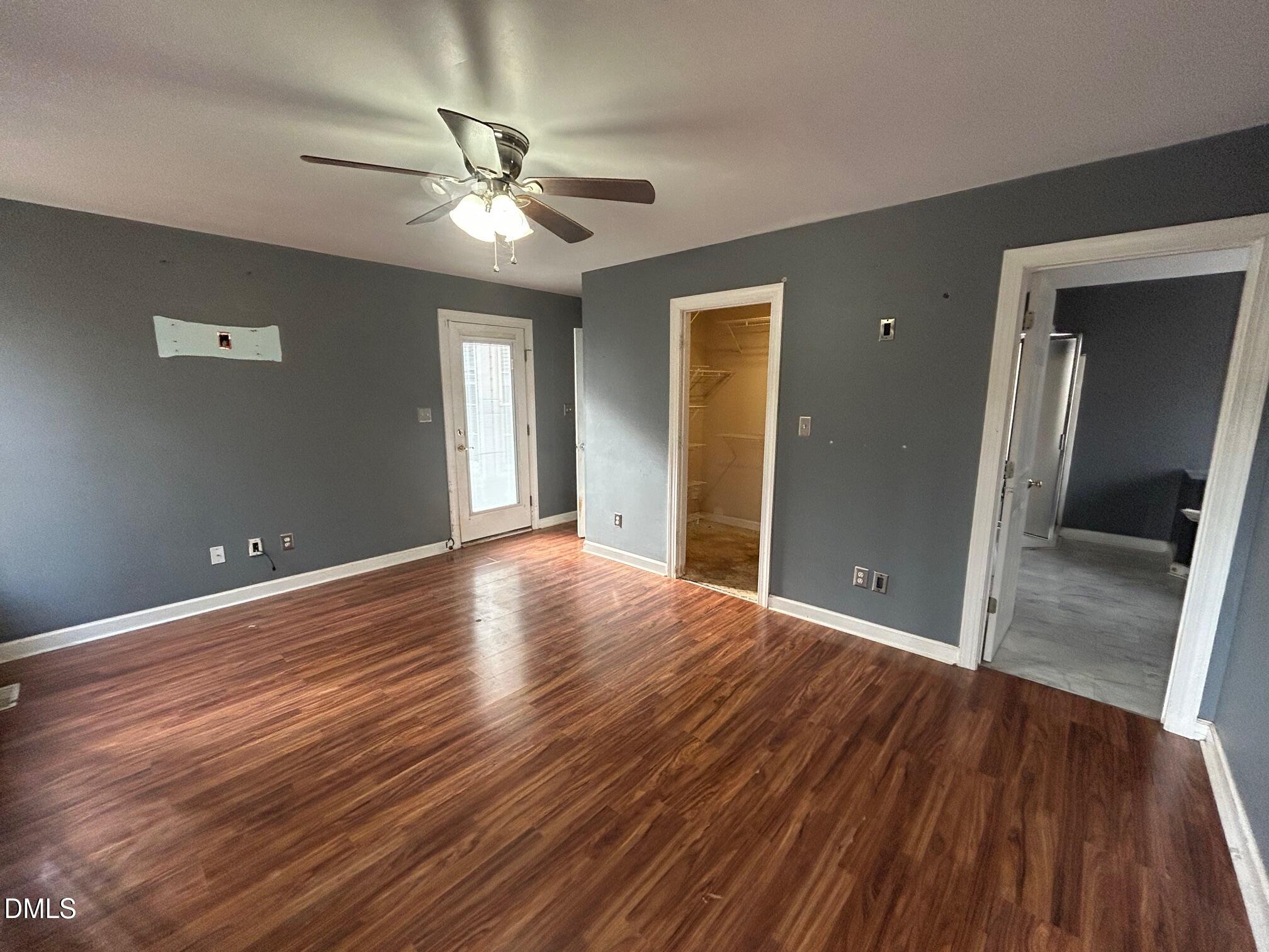 1220 Oxford Loop Road Oxford, NC 27565 - Photo 16 of 30 a view of a livingroom with a hall and wooden floor