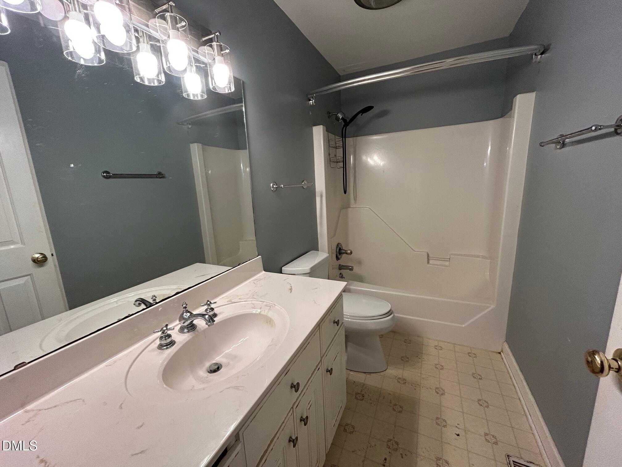 1220 Oxford Loop Road Oxford, NC 27565 - Photo 21 of 30 a bathroom with a sink a toilet and shower